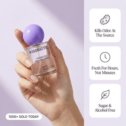 KissBiotic held in hand with three benefit cards